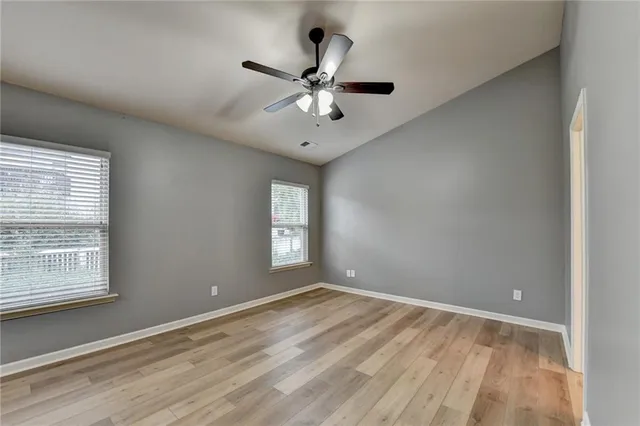 a view of a house with a yard and plants