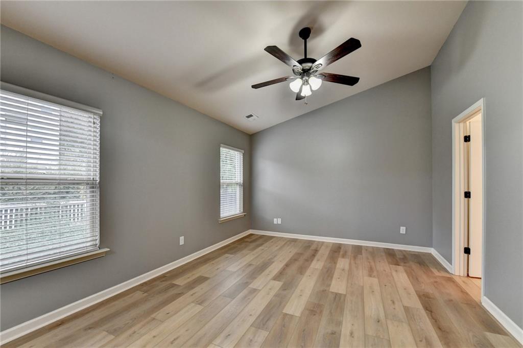 5013 Groover Drive Smyrna, GA 30080 - Photo 50 of 70 a view of empty room with wooden floor and fan