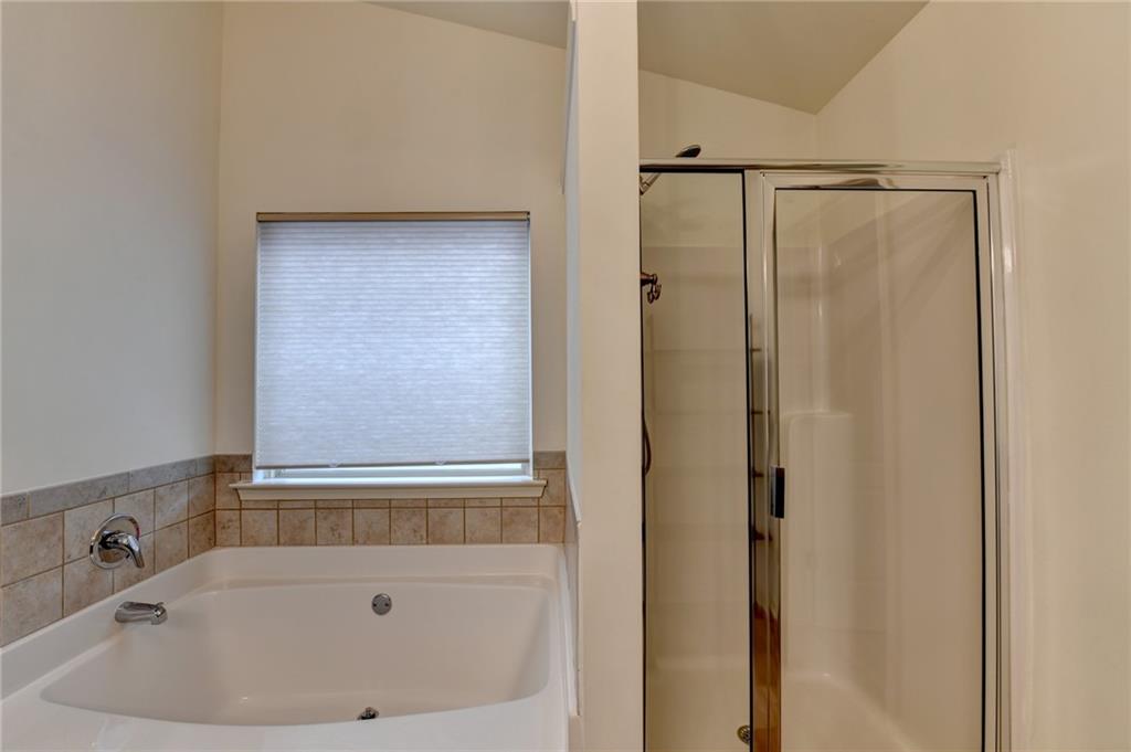 5013 Groover Drive Smyrna, GA 30080 - Photo 59 of 70 a bathroom with a bathtub and a shower