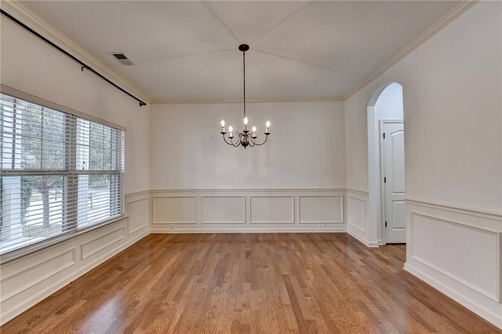 5013 Groover Drive Smyrna, GA 30080 - Photo 6 of 70 a view of an empty room with wooden floor and a window