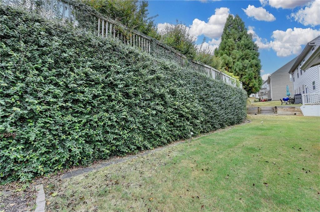 5013 Groover Drive Smyrna, GA 30080 - Photo 66 of 70 a view of a yard with plants and brick wall