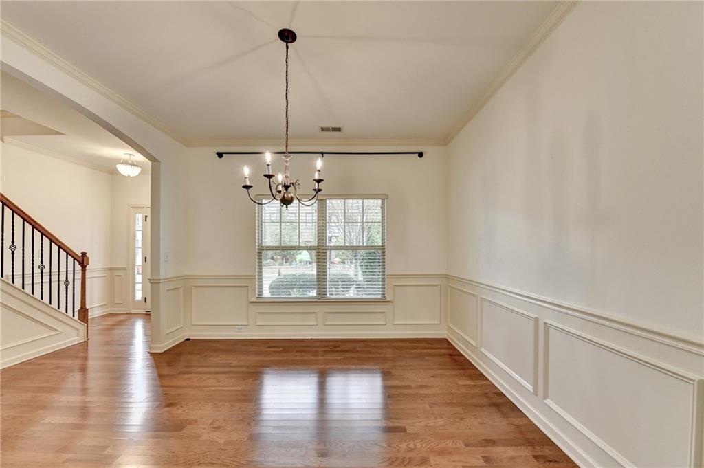 5013 Groover Drive Smyrna, GA 30080 - Photo 9 of 70 a view of an empty room with wooden floor and a window