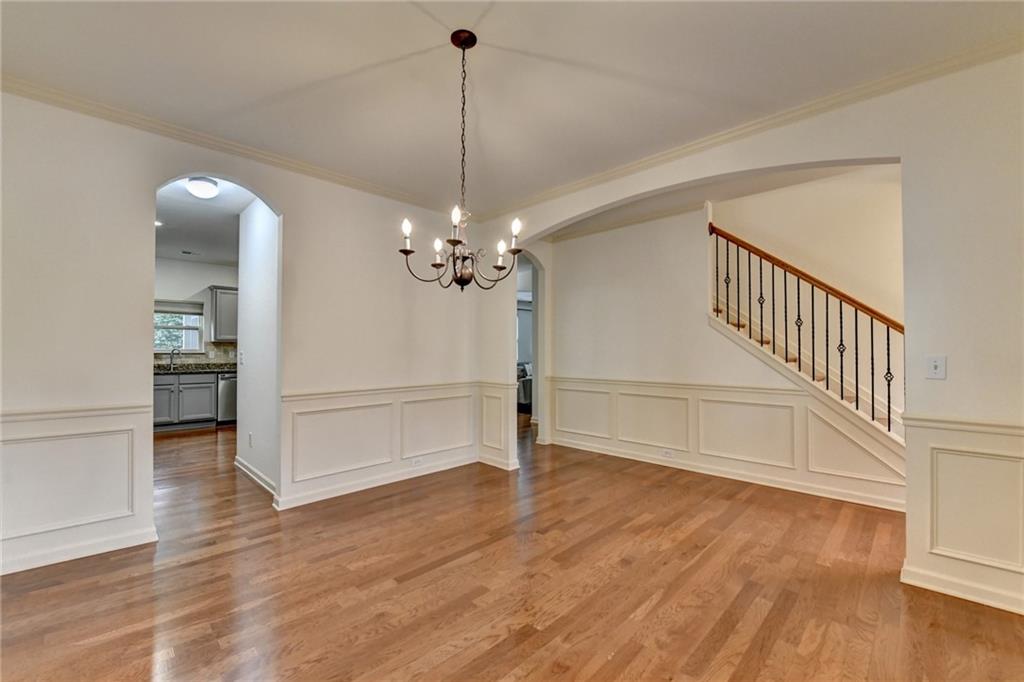 5013 Groover Drive Smyrna, GA 30080 - Photo 10 of 70 a view of a livingroom with wooden floor and a chandelier