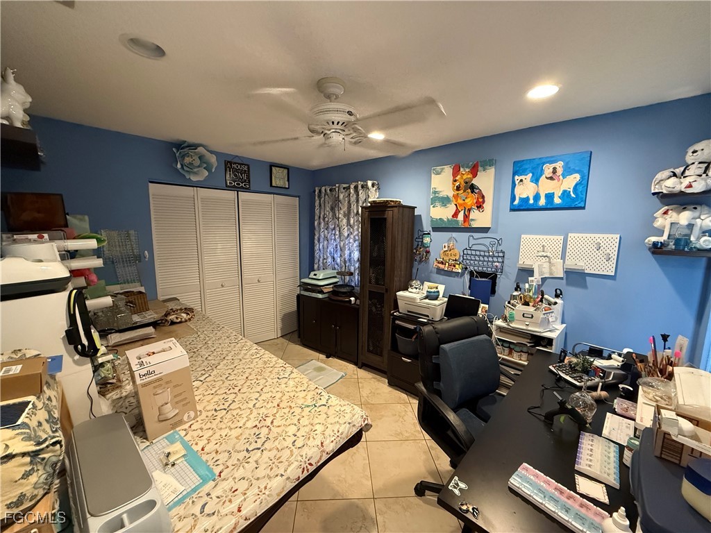 9141 Southwest 22nd Street Boca Raton, FL 33428 - Photo 12 of 14 a room with gym equipment and a flat screen tv