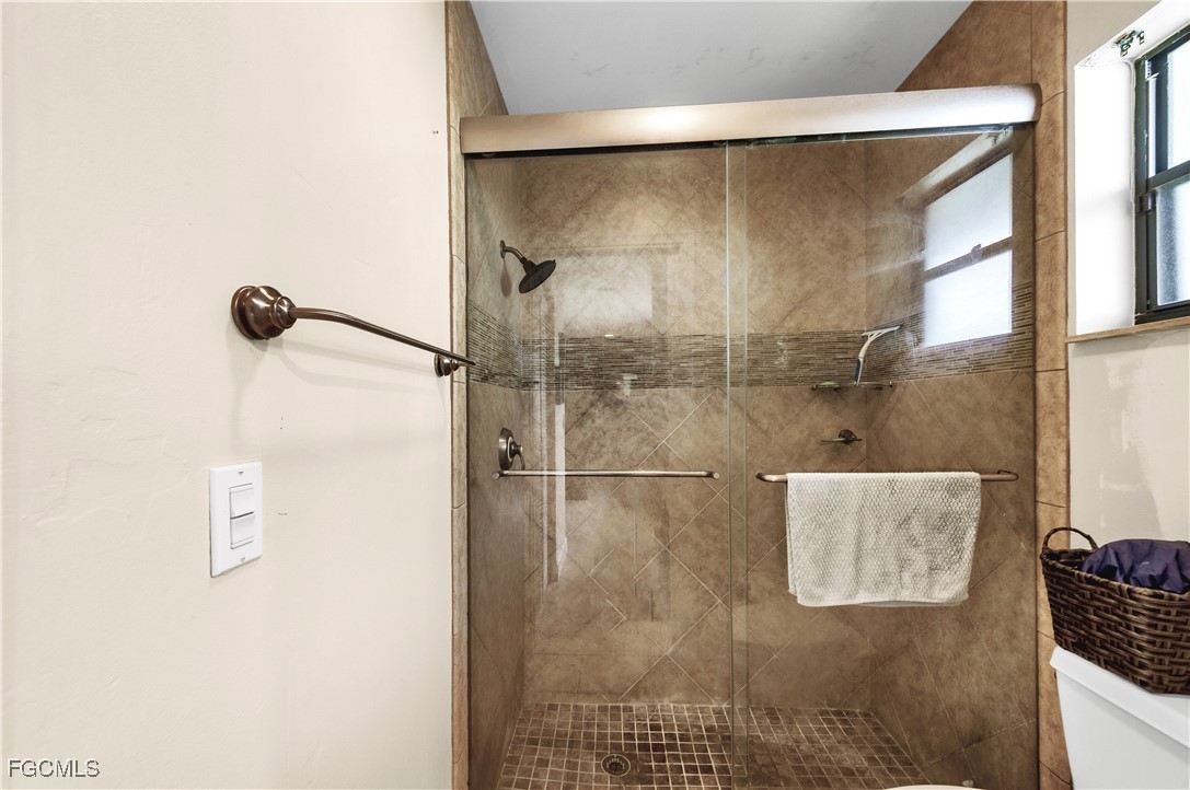 9141 Southwest 22nd Street, Unit F Boca Raton, FL 33428 - Photo 15 of 30 a bathroom with a shower