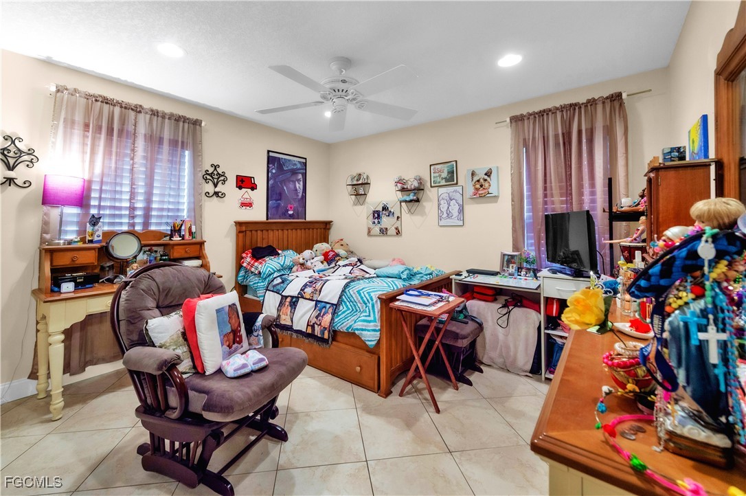 9141 Southwest 22nd Street, Unit F Boca Raton, FL 33428 - Photo 23 of 30 a living room filled with furniture and a flat screen tv