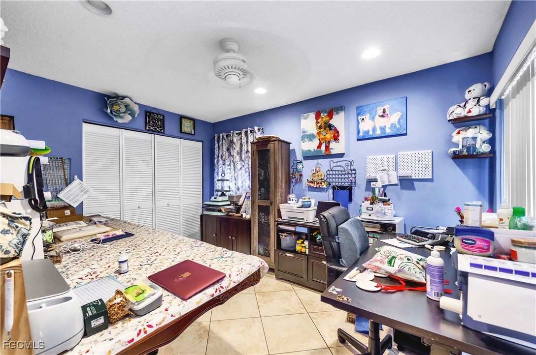 9141 Southwest 22nd Street, Unit F Boca Raton, FL 33428 - Photo 26 of 30 a bed room with a bed and a television