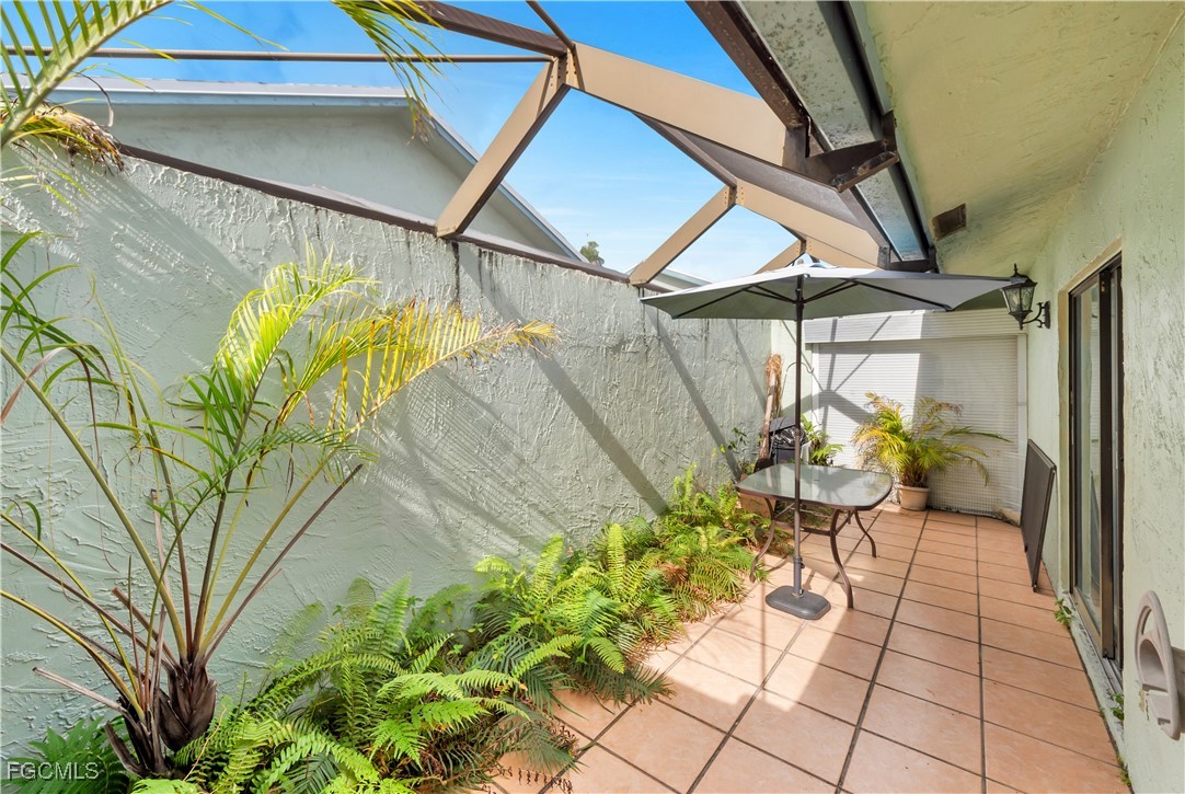 9141 Southwest 22nd Street, Unit F Boca Raton, FL 33428 - Photo 28 of 30 a backyard of a house with outdoor seating