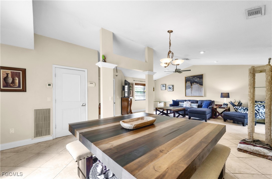 9141 Southwest 22nd Street, Unit F Boca Raton, FL 33428 - Photo 5 of 30 a living room with furniture and a chandelier
