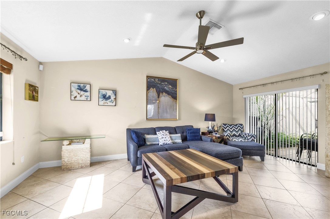 9141 Southwest 22nd Street, Unit F Boca Raton, FL 33428 - Photo 6 of 30 a living room with furniture and a window