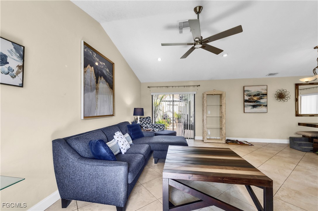 9141 Southwest 22nd Street, Unit F Boca Raton, FL 33428 - Photo 9 of 30 a living room with furniture and a wooden floor