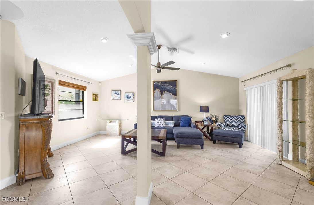 9141 Southwest 22nd Street, Unit F Boca Raton, FL 33428 - Photo 10 of 30 a living room with furniture and a window