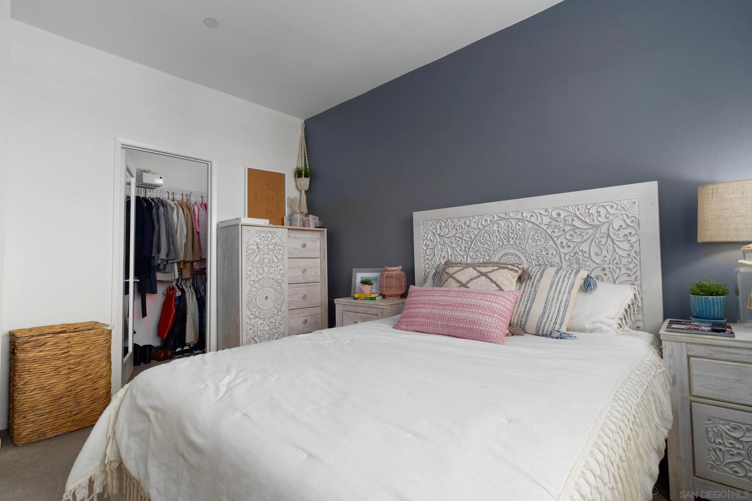 1380 Santa Victoria Road, Unit 2 Chula Vista, CA 91913 - Photo 14 of 27 a bedroom with a bed and a closet