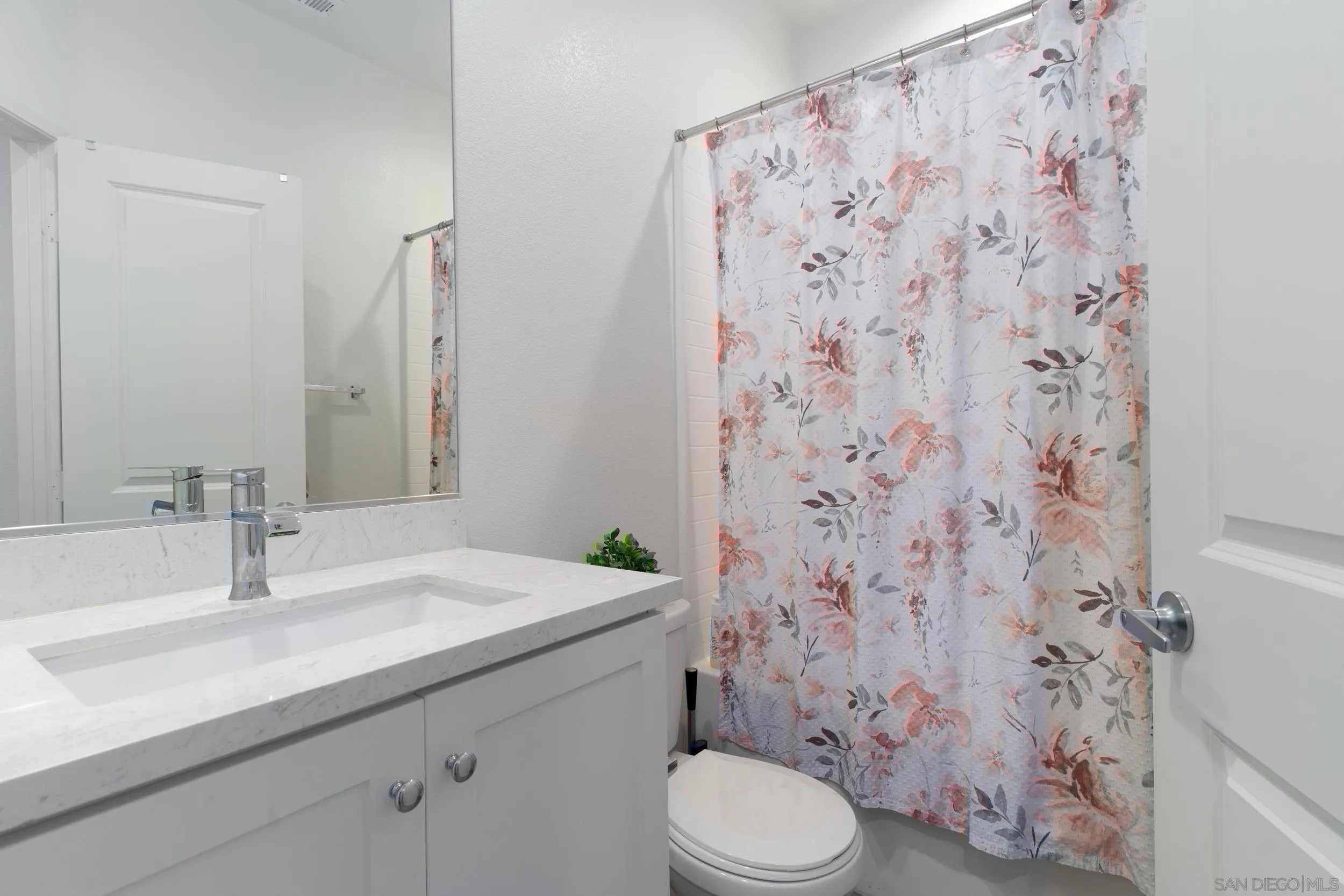 1380 Santa Victoria Road, Unit 2 Chula Vista, CA 91913 - Photo 17 of 27 a bathroom with a sink toilet and shower