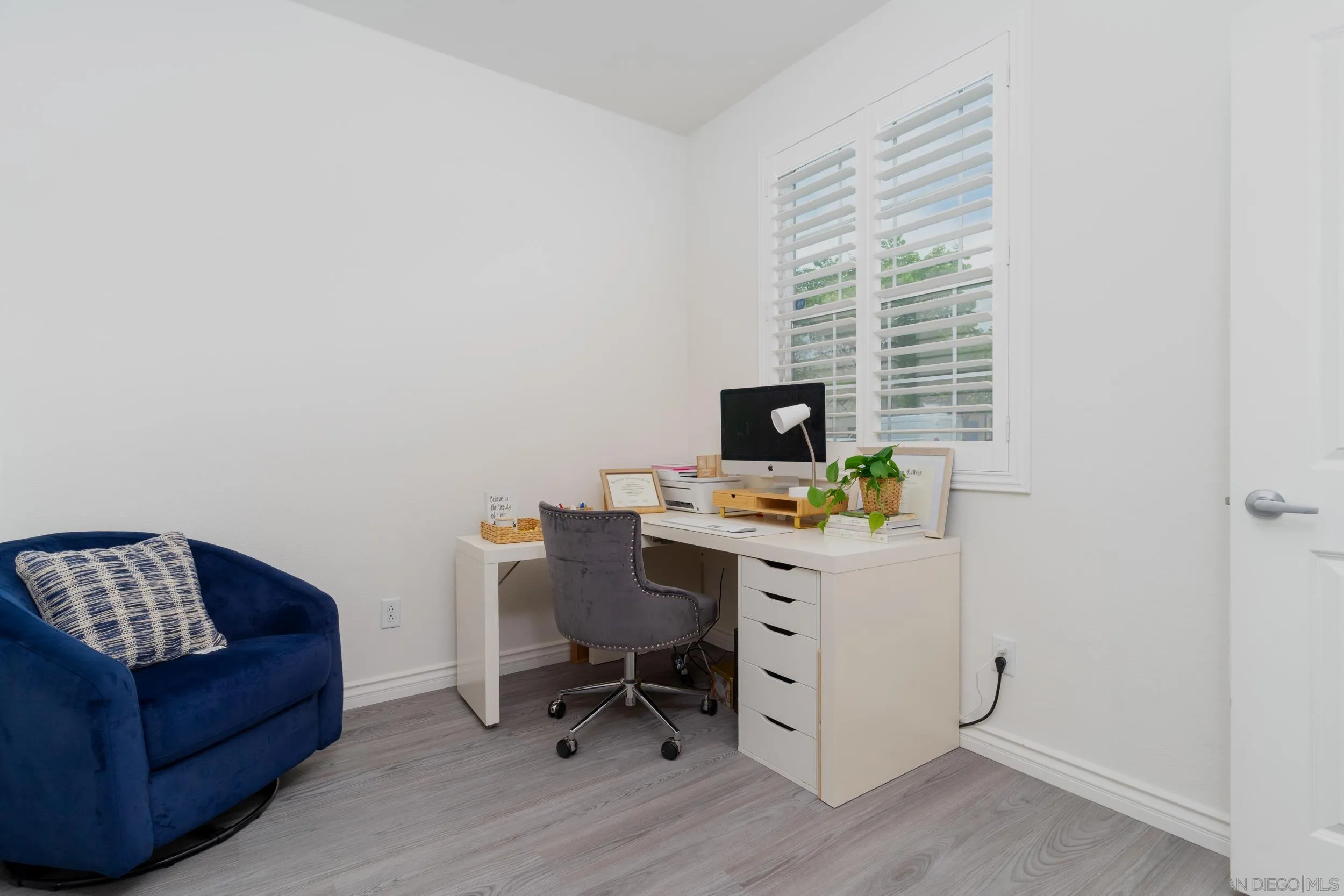 1380 Santa Victoria Road, Unit 2 Chula Vista, CA 91913 - Photo 3 of 27 a view of a workspace with furniture and a window