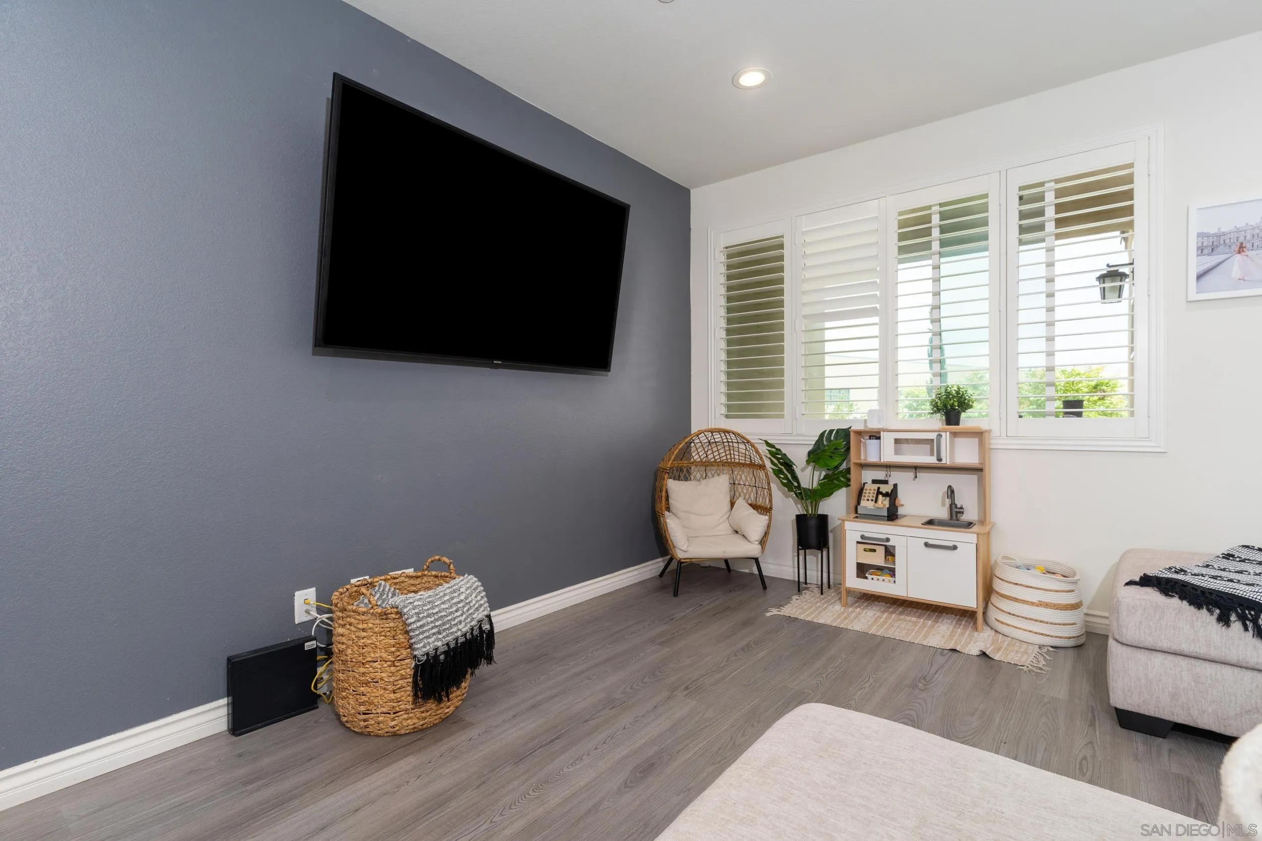 1380 Santa Victoria Road, Unit 2 Chula Vista, CA 91913 - Photo 5 of 27 a living room with furniture and a flat screen tv