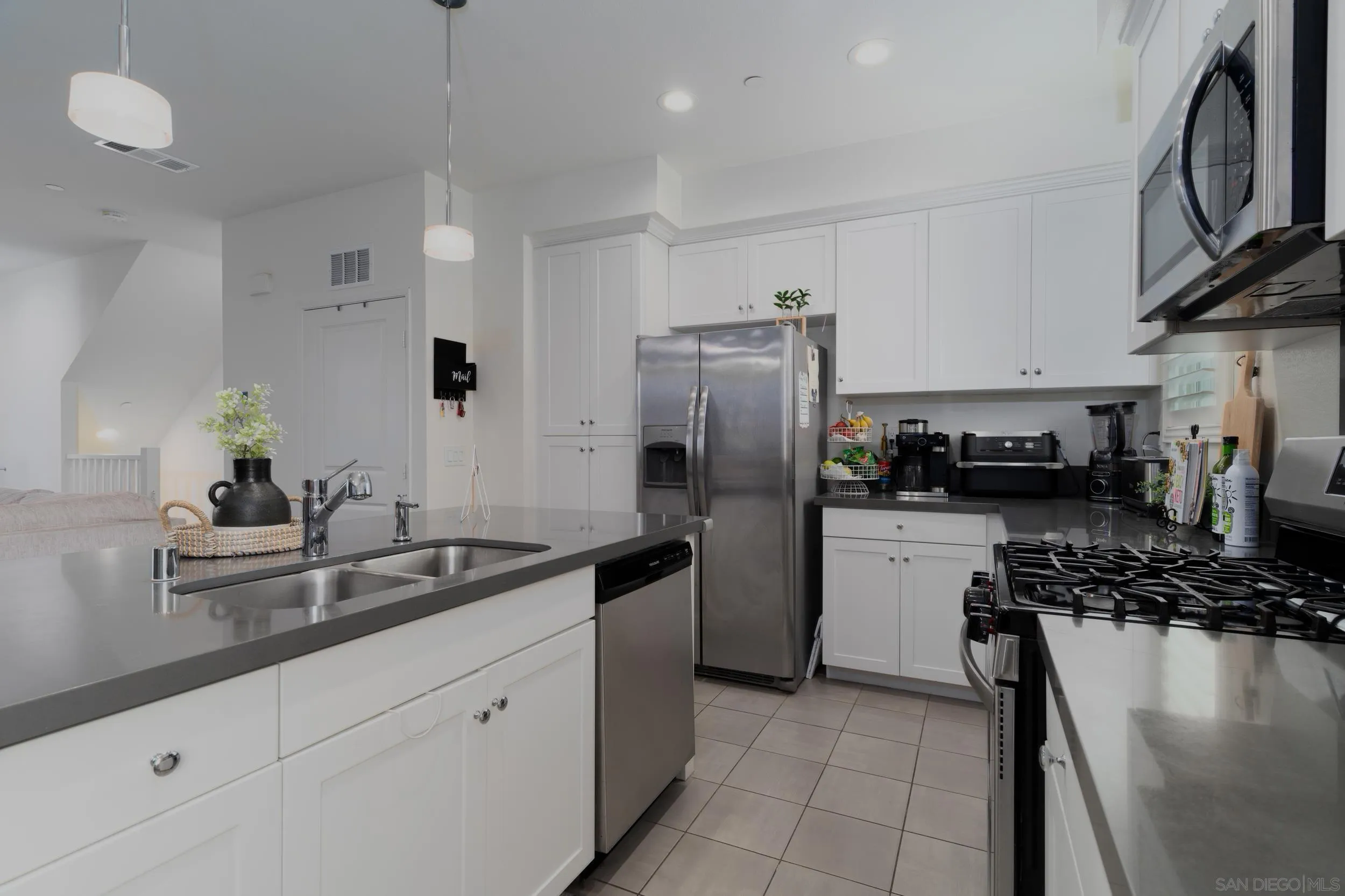 1380 Santa Victoria Road, Unit 2 Chula Vista, CA 91913 - Photo 8 of 27 a kitchen with a refrigerator and a sink