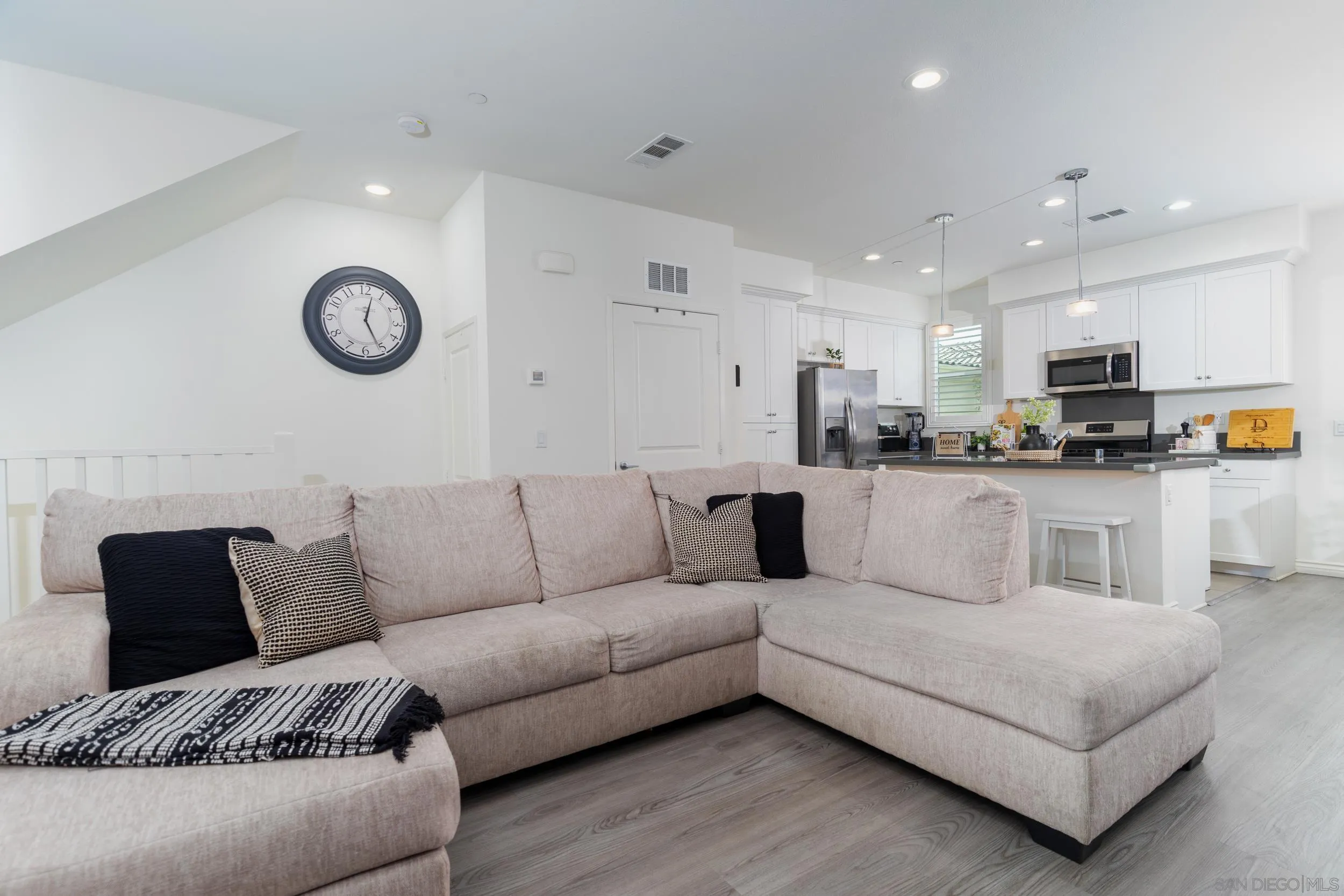 1380 Santa Victoria Road, Unit 2 Chula Vista, CA 91913 - Photo 10 of 27 a living room with furniture and kitchen view