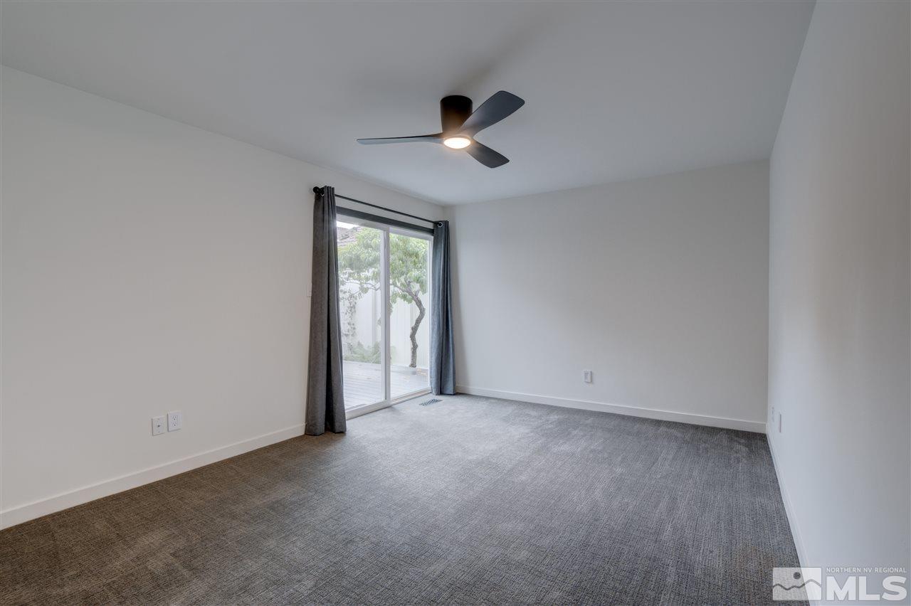 1221 Laredo Court Reno, NV 89503 - Photo 13 of 32 an empty room with ceiling fan and window
