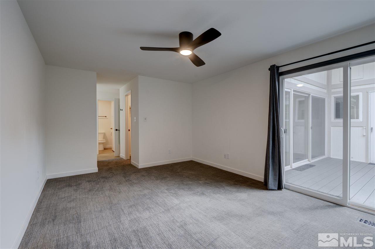 1221 Laredo Court Reno, NV 89503 - Photo 14 of 32 wooden floor in an empty room and a window