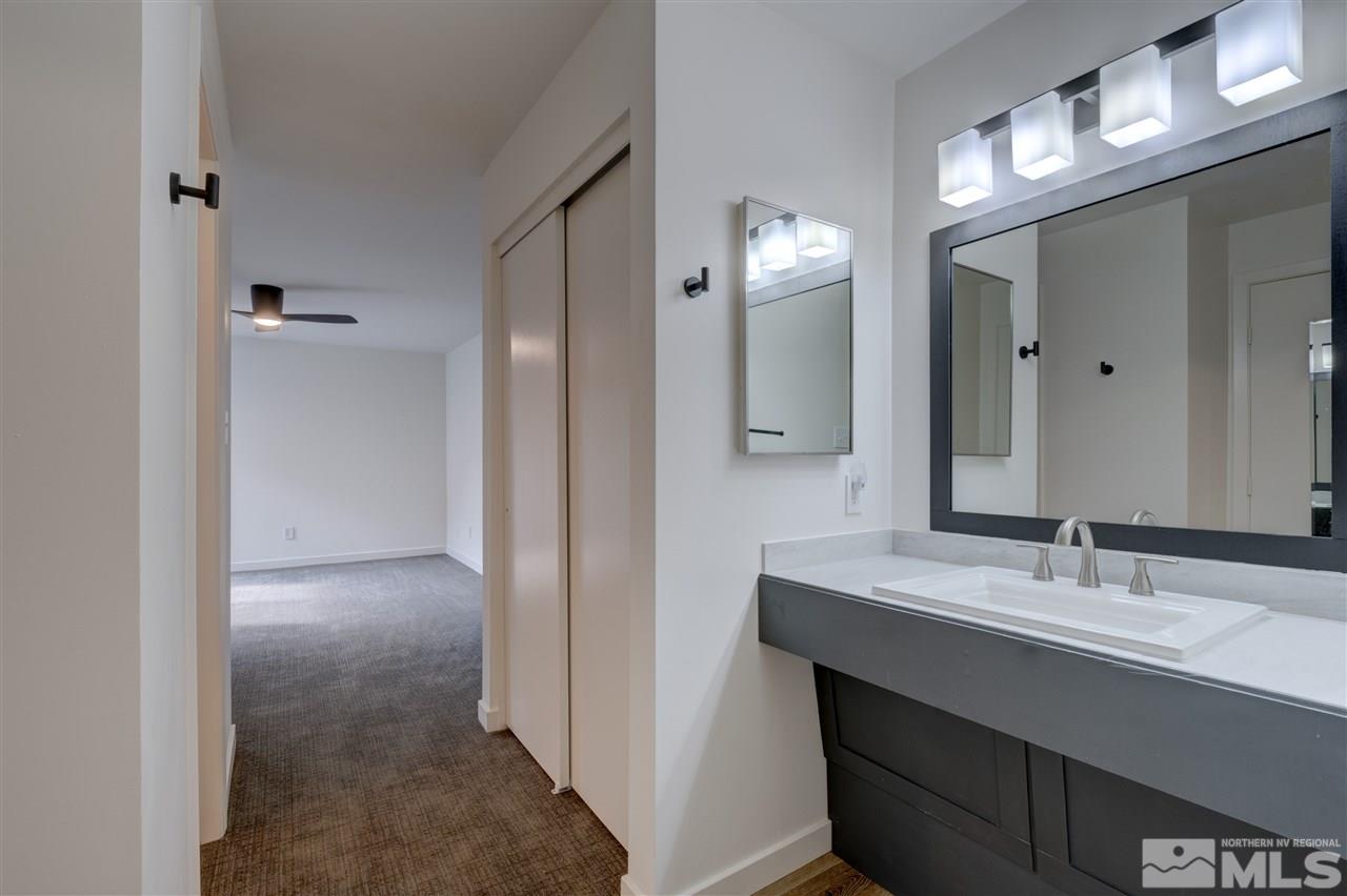 1221 Laredo Court Reno, NV 89503 - Photo 15 of 32 a bathroom with a sink and a mirror