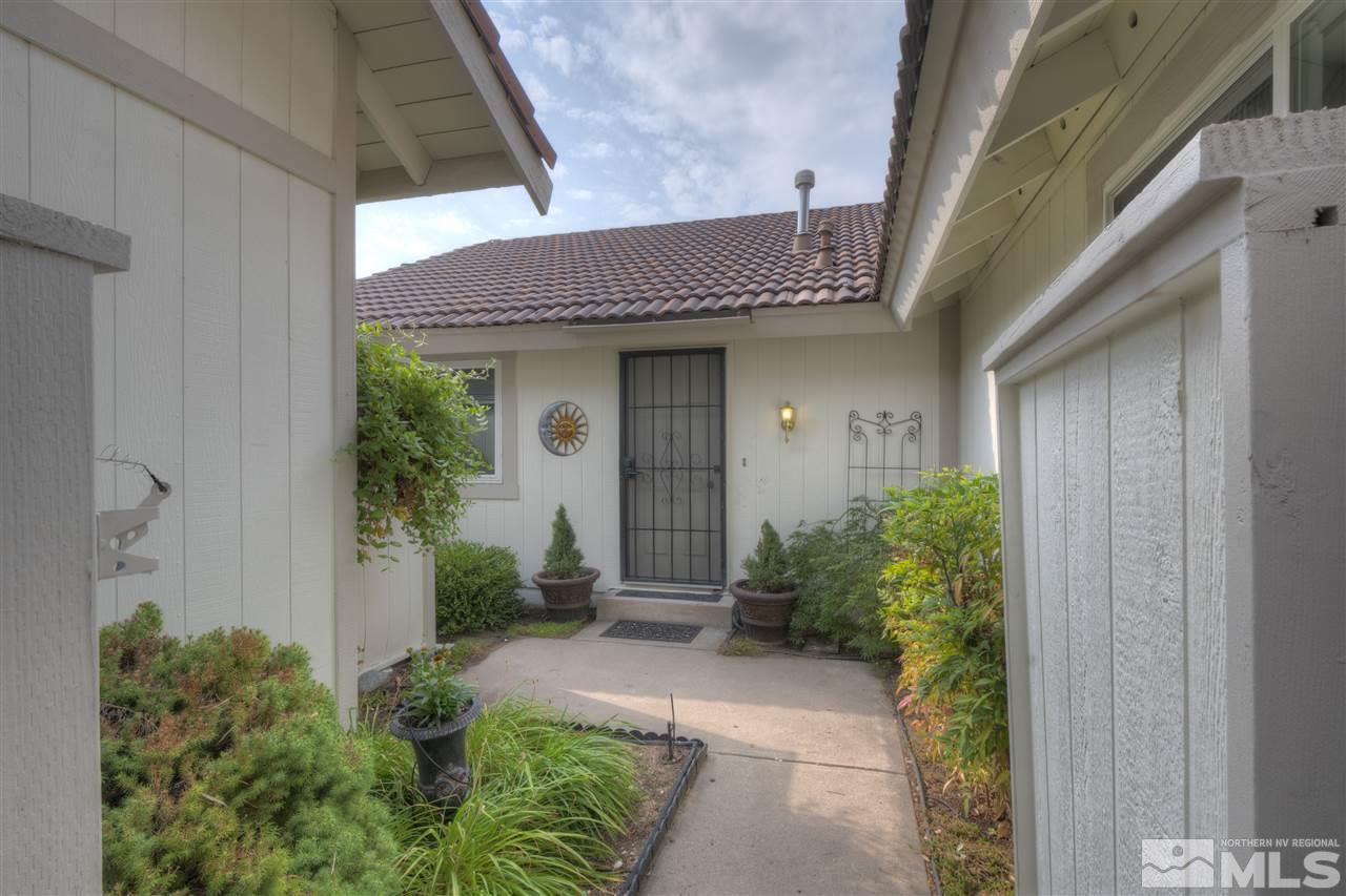 1221 Laredo Court Reno, NV 89503 - Photo 3 of 32 a view of a house with potted plants