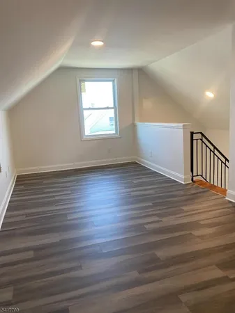 a view of gallery with wooden floor