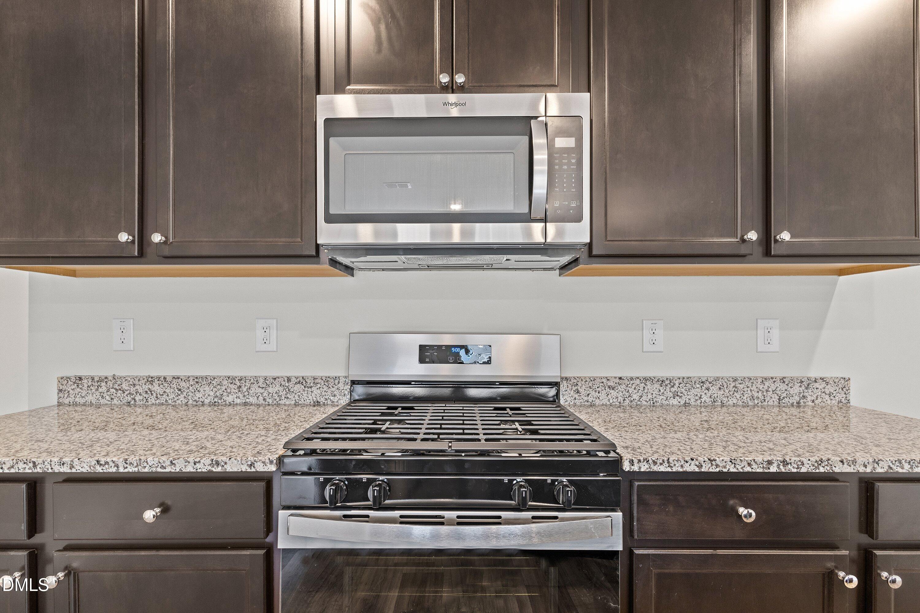 2550 Olive Chapel Road Apex, NC 27502 - Photo 14 of 41 a stove top oven sitting inside of a kitchen