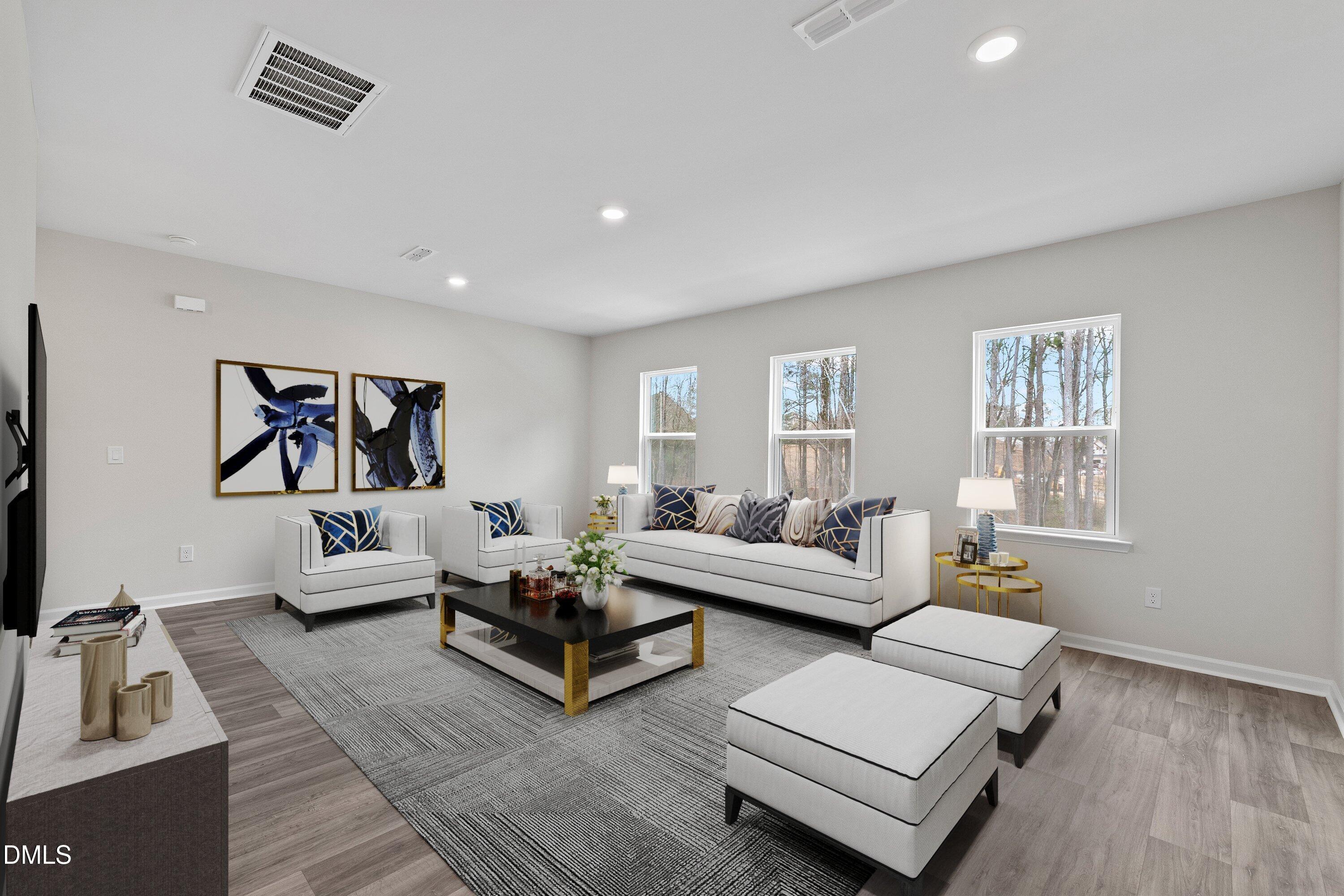 2550 Olive Chapel Road Apex, NC 27502 - Photo 18 of 41 a living room with furniture or couch and a wooden floor
