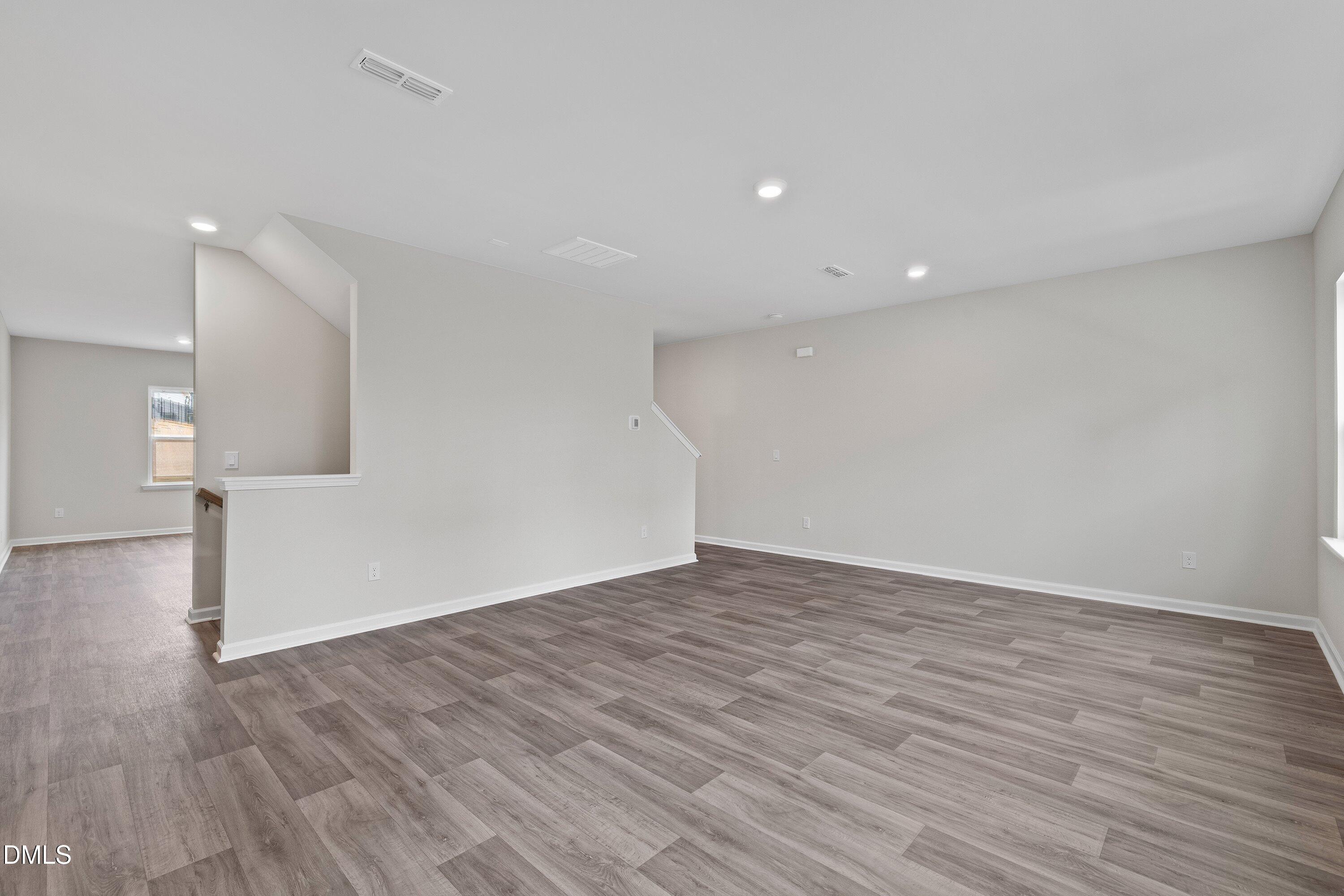 2550 Olive Chapel Road Apex, NC 27502 - Photo 20 of 41 a view of empty room with wooden floor