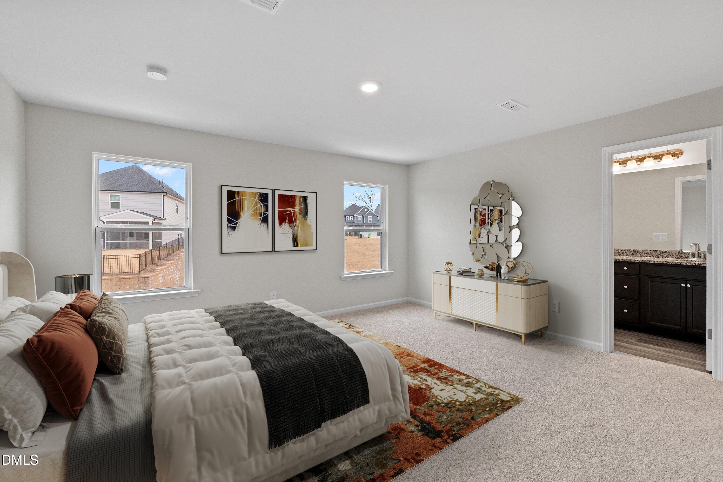 2550 Olive Chapel Road Apex, NC 27502 - Photo 25 of 41 a bedroom with a bed and wooden floor