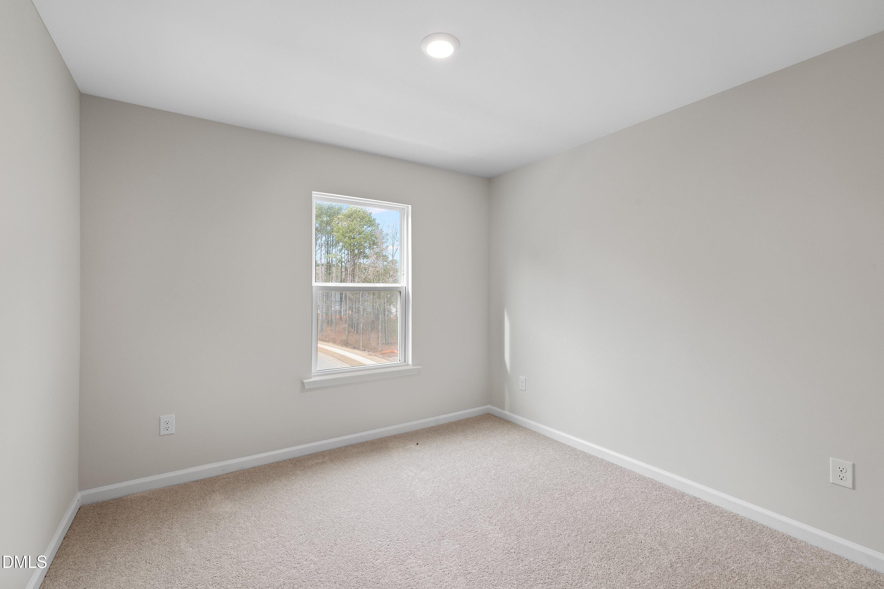 2550 Olive Chapel Road Apex, NC 27502 - Photo 33 of 41 an empty room with a window