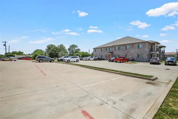 a view of multiple houses with yard