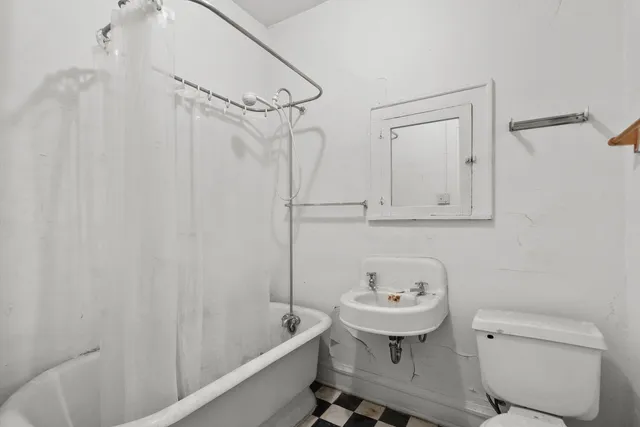 a kitchen with granite countertop cabinets and window