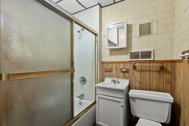 a kitchen with a refrigerator and a stove