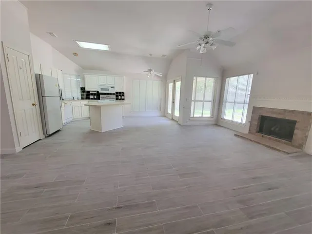 a view of an empty room with a fireplace