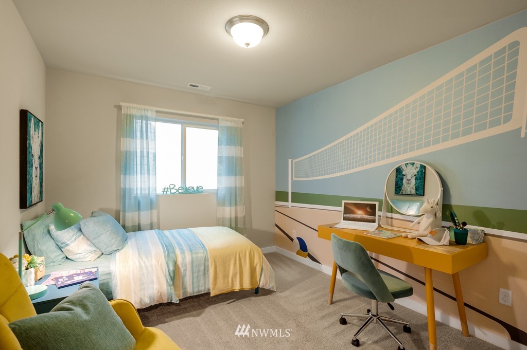 28 211th Street Southeast, Unit P20 Bothell, WA 98021 - Photo 22 of 40 a bedroom with a bed and large windows