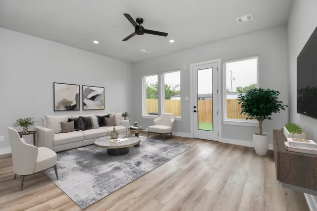 a living room with furniture and a large window