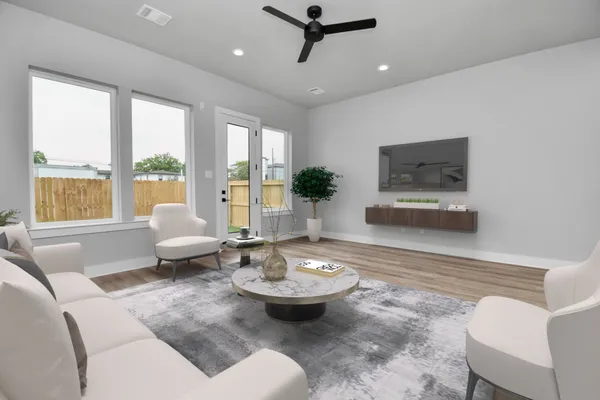 a living room with furniture and a large window