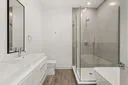 a bathroom with a bathtub and a sink