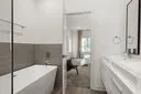 a bathroom with a bathtub and a shower