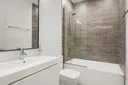 a bathroom with a bathtub and a sink