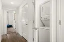 a view of a bathroom from a corridor