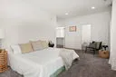 a bedroom with a bed and couch