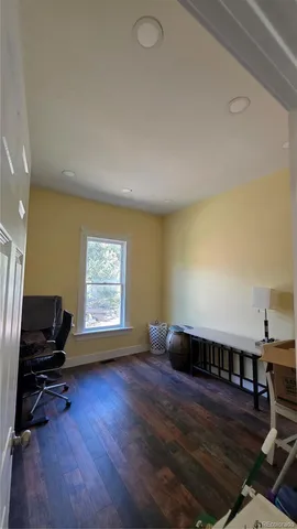a view of workspace with wooden floor and window