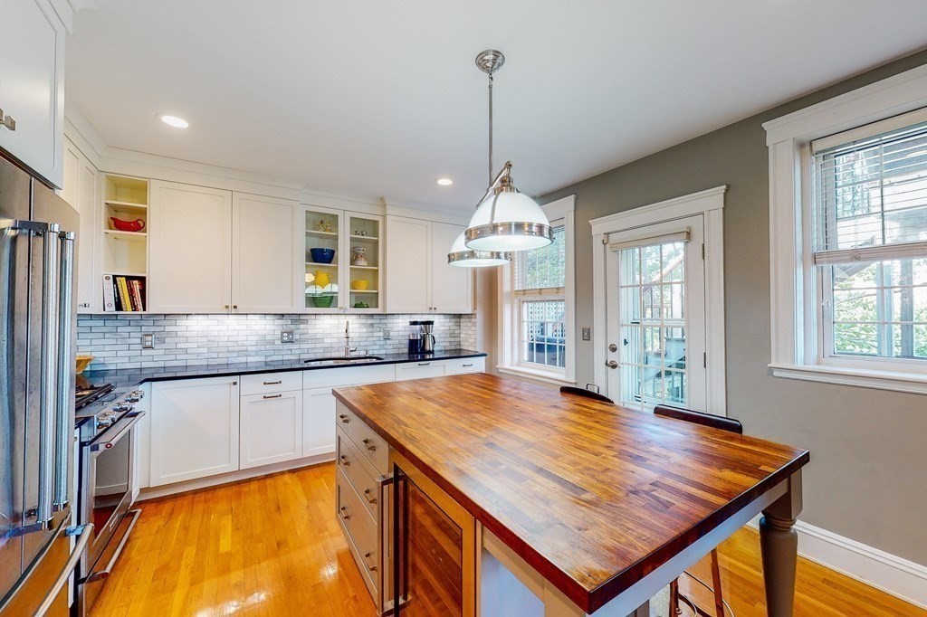 94 University Road, Unit 4 Brookline, MA 02446 - Photo 1 of 27 a kitchen with stainless steel appliances granite countertop stove top oven and refrigerator