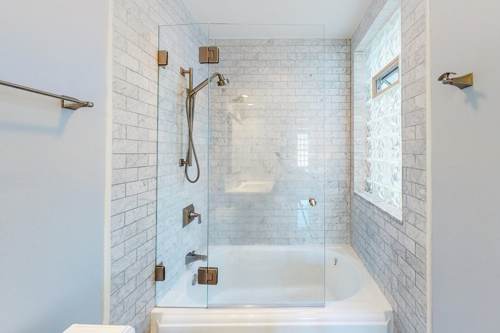94 University Road, Unit 4 Brookline, MA 02446 - Photo 11 of 27 a bathroom with a shower and a bathtub