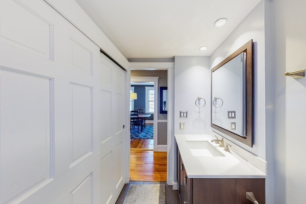 94 University Road, Unit 4 Brookline, MA 02446 - Photo 16 of 27 a bathroom with a sink and a mirror