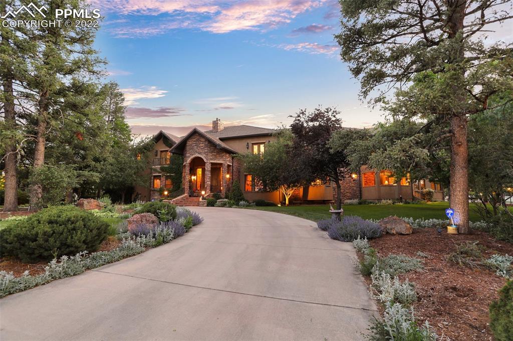 4 3rd Street Colorado Springs, CO 80906 - Photo 3 of 50 a front view of a house with a yard and outdoor seating