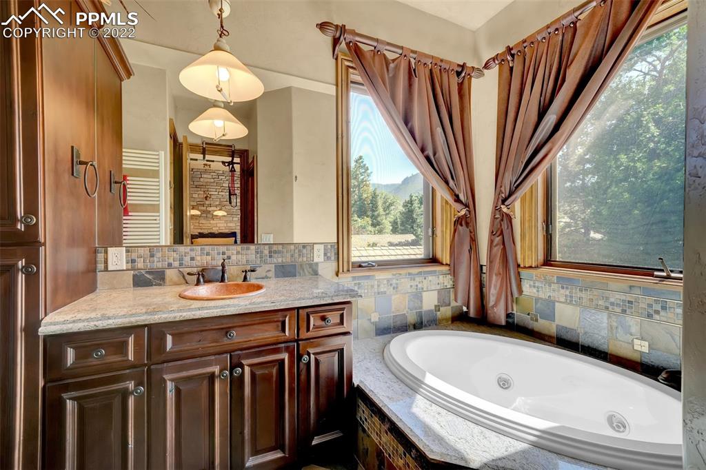 4 3rd Street Colorado Springs, CO 80906 - Photo 35 of 50 a bathroom with a bathtub and a sink